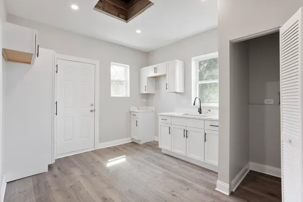 a view of a kitchen sink and a window