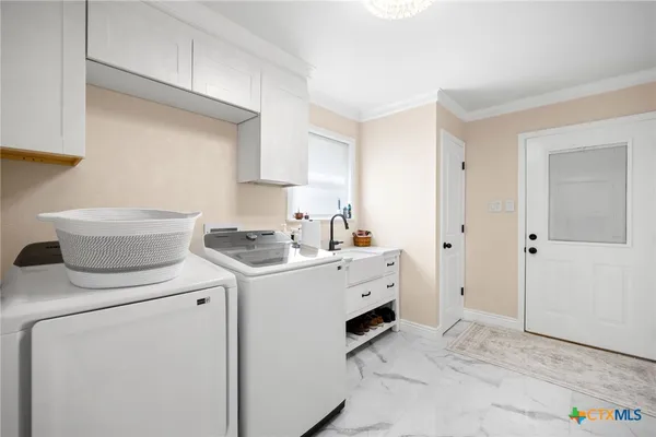 a hallway with cabinets and wooden floor