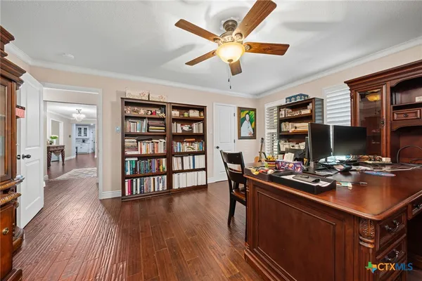 a spacious bedroom with a bed and a couch