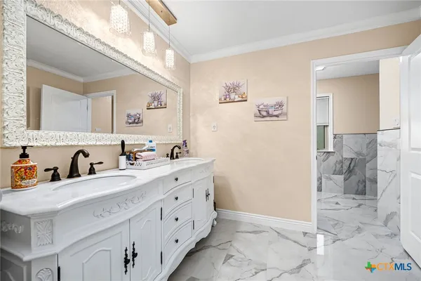 a bedroom with a bed and ceiling fan