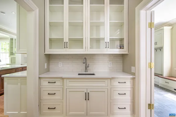 a kitchen with cabinets appliances and a window