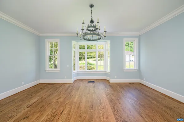 a spacious bathroom with a bathtub sink and mirror