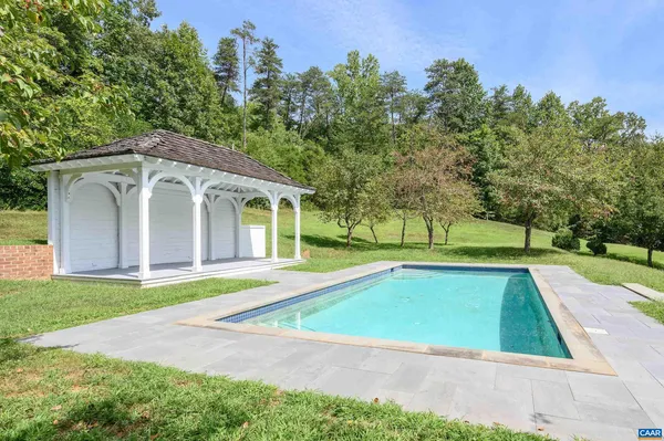 a view of outdoor space yard swimming pool and green space