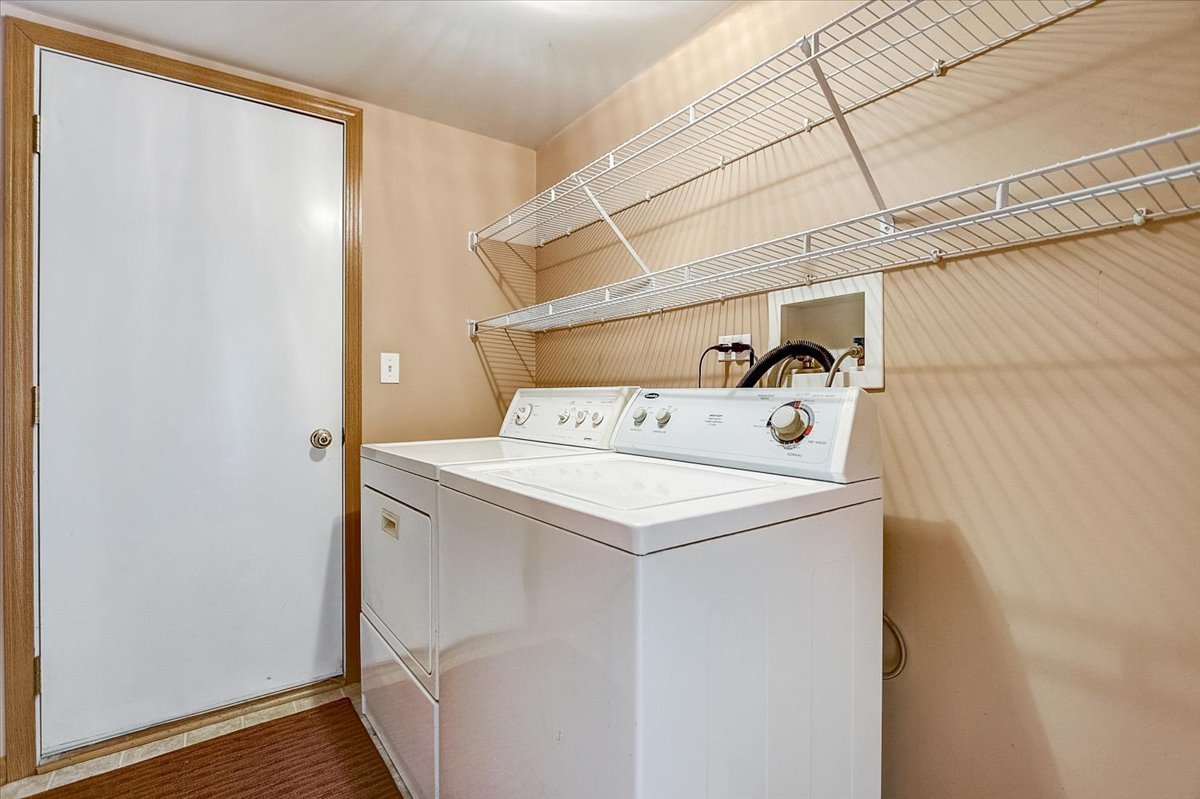63 Rolling Oaks Road, Unit B Sugar Grove, IL 60554 - Photo 20 of 23 a utility room with dryer and washer