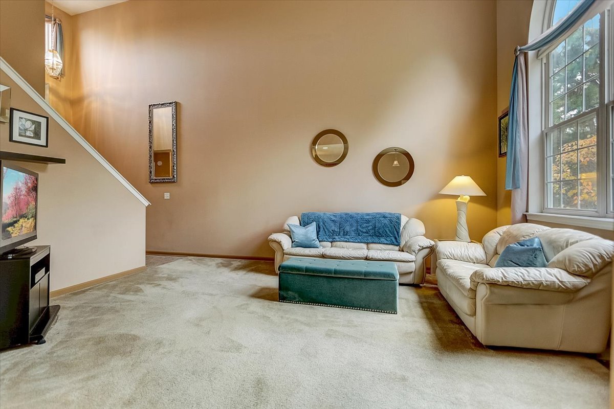 63 Rolling Oaks Road, Unit B Sugar Grove, IL 60554 - Photo 5 of 23 a living room with furniture and a window