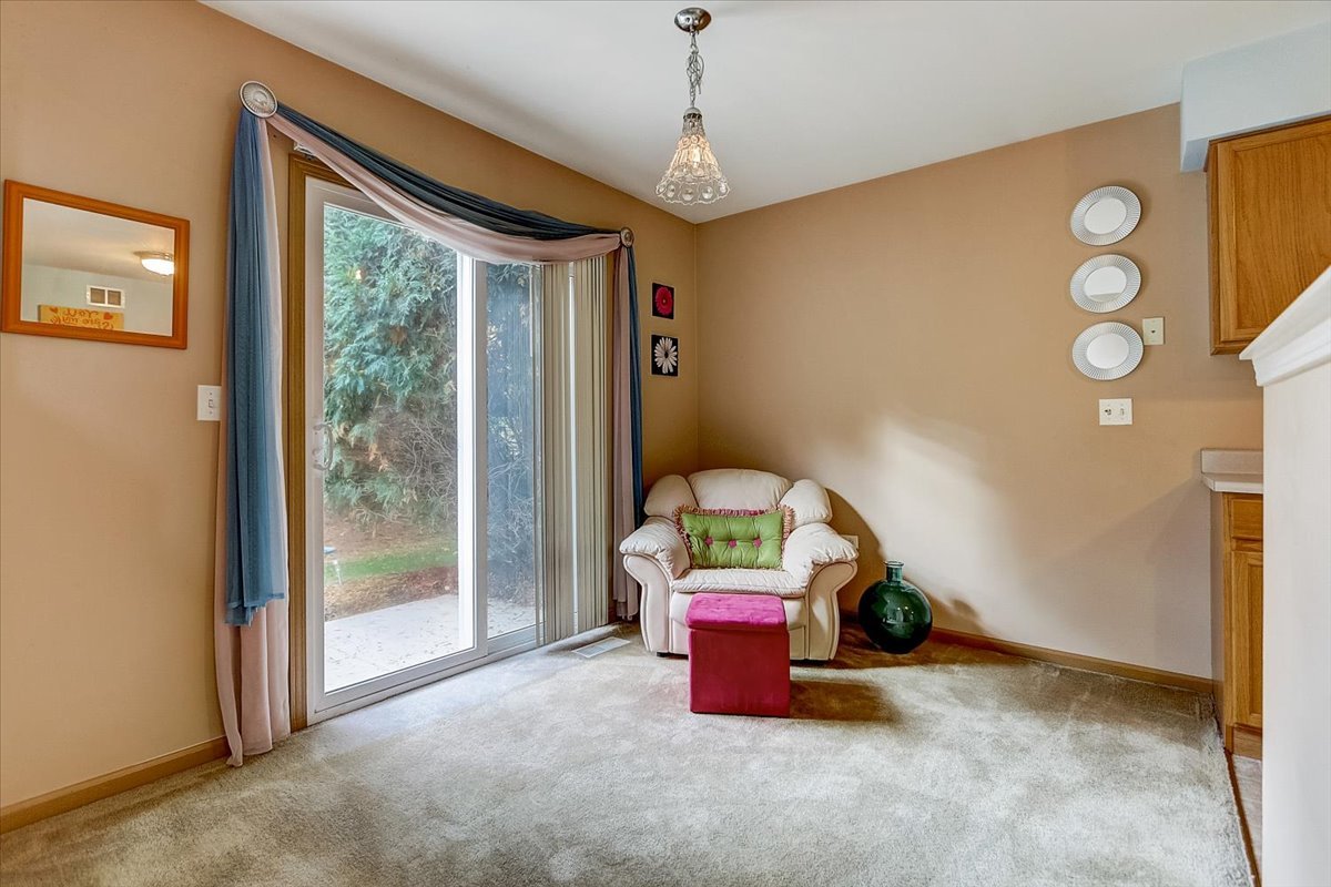 63 Rolling Oaks Road, Unit B Sugar Grove, IL 60554 - Photo 7 of 23 a view of room with air conditioner duct and windows
