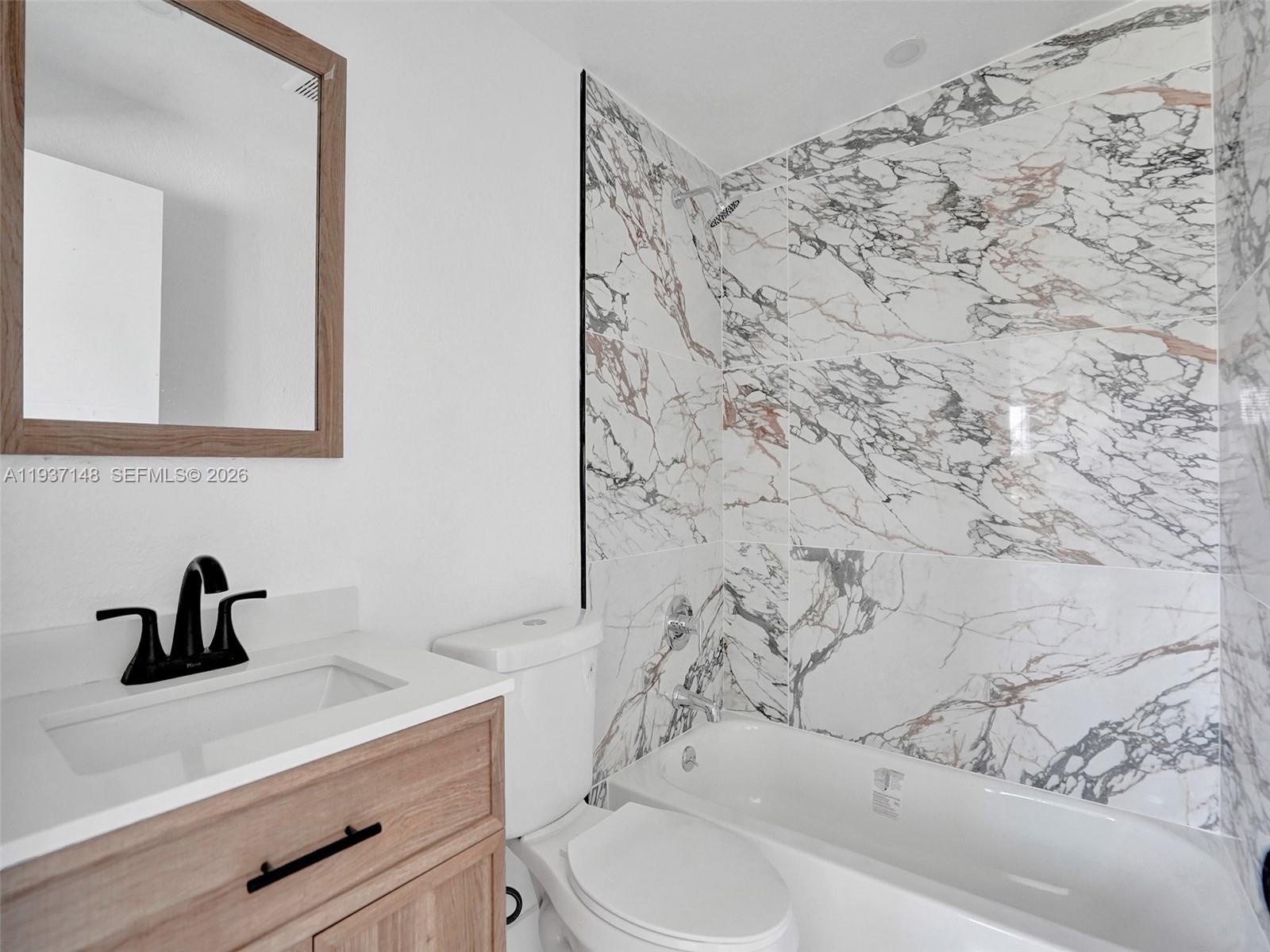 6143 Southwest 40th Street Miramar, FL 33023 - Photo 18 of 24 a bathroom with a sink and a toilet