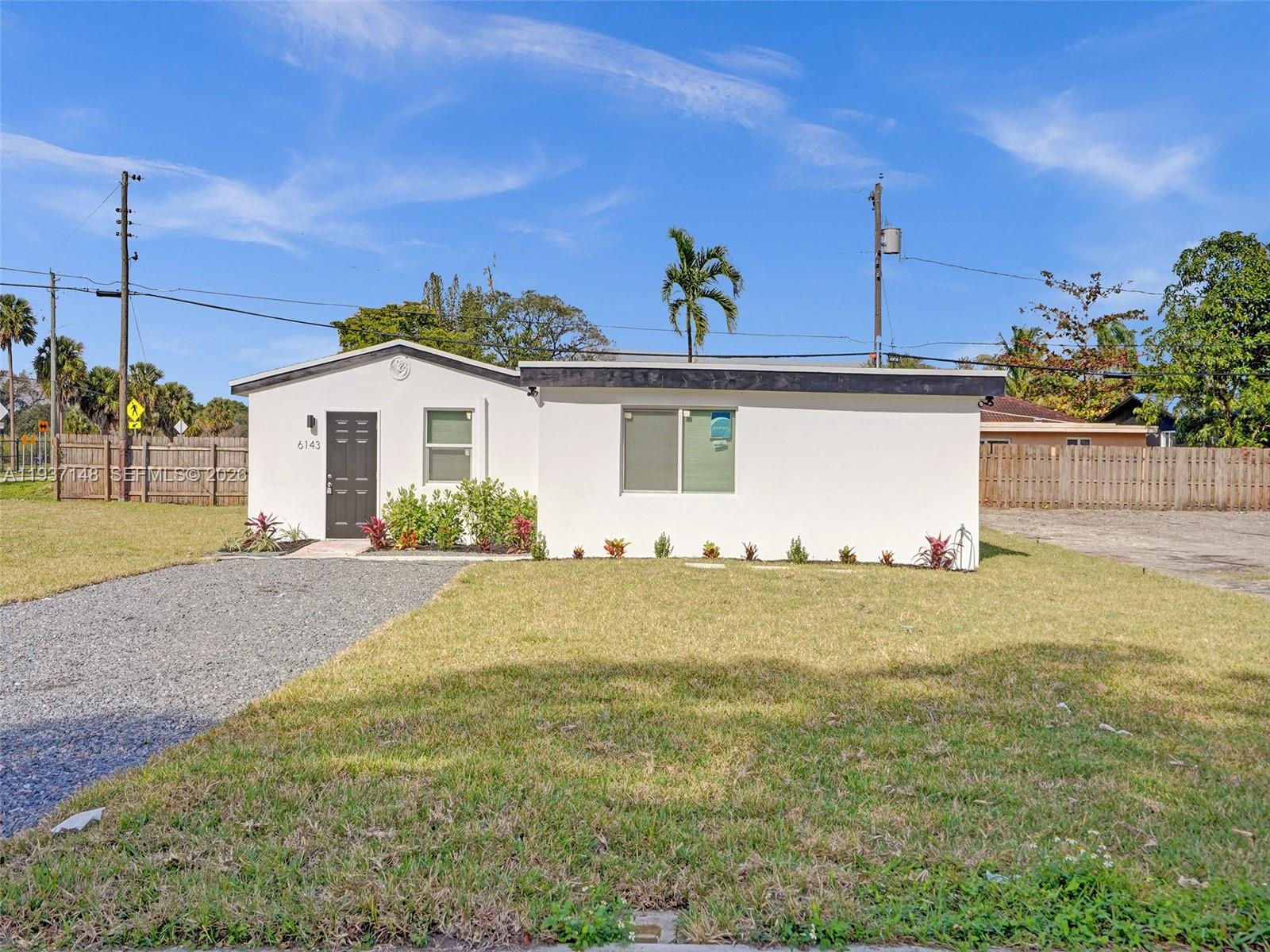 6143 Southwest 40th Street Miramar, FL 33023 - Photo 2 of 24 a view of a house with a yard
