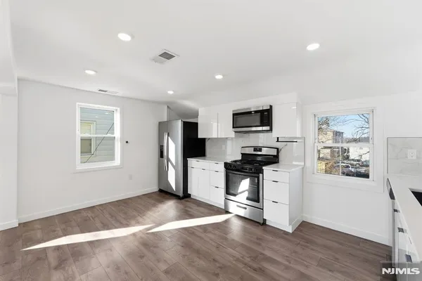 a view of a back yard of the house