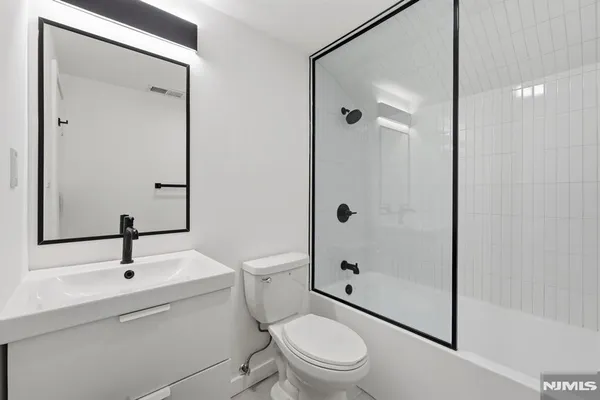 a view of a backyard with large trees