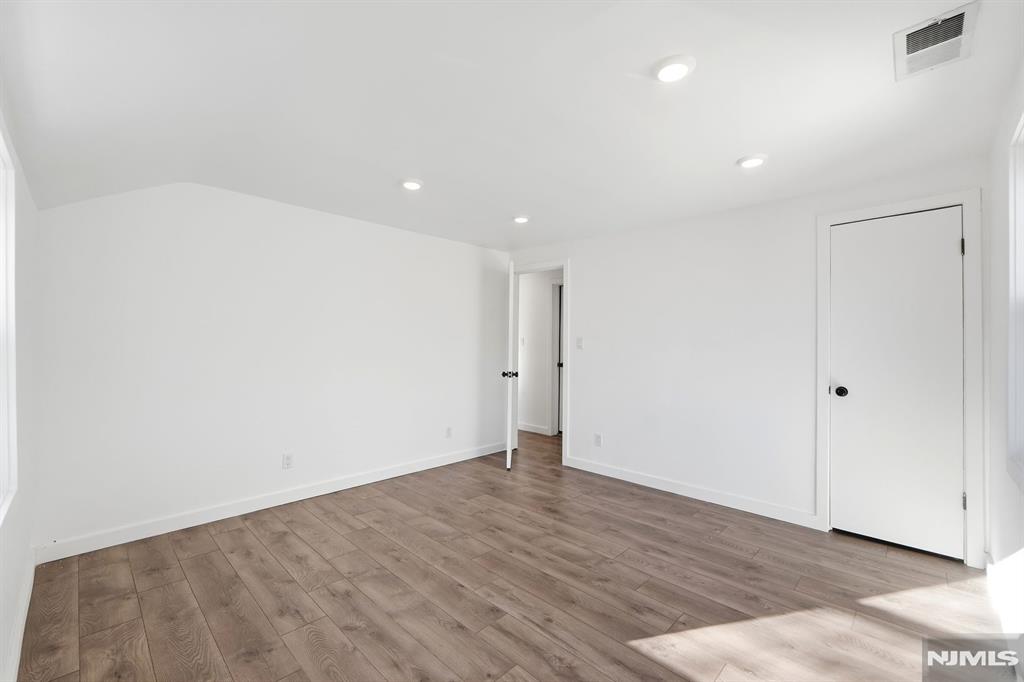 73 MacArthur Avenue Lodi, NJ 07644 - Photo 27 of 46 a view of an empty room