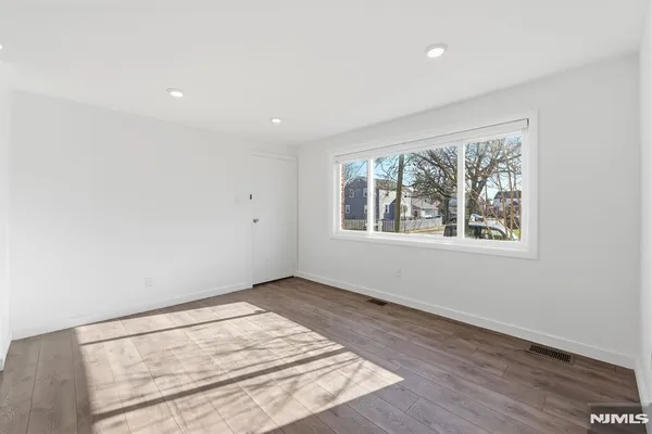 a kitchen with stainless steel appliances a refrigerator freezer and a stove top oven