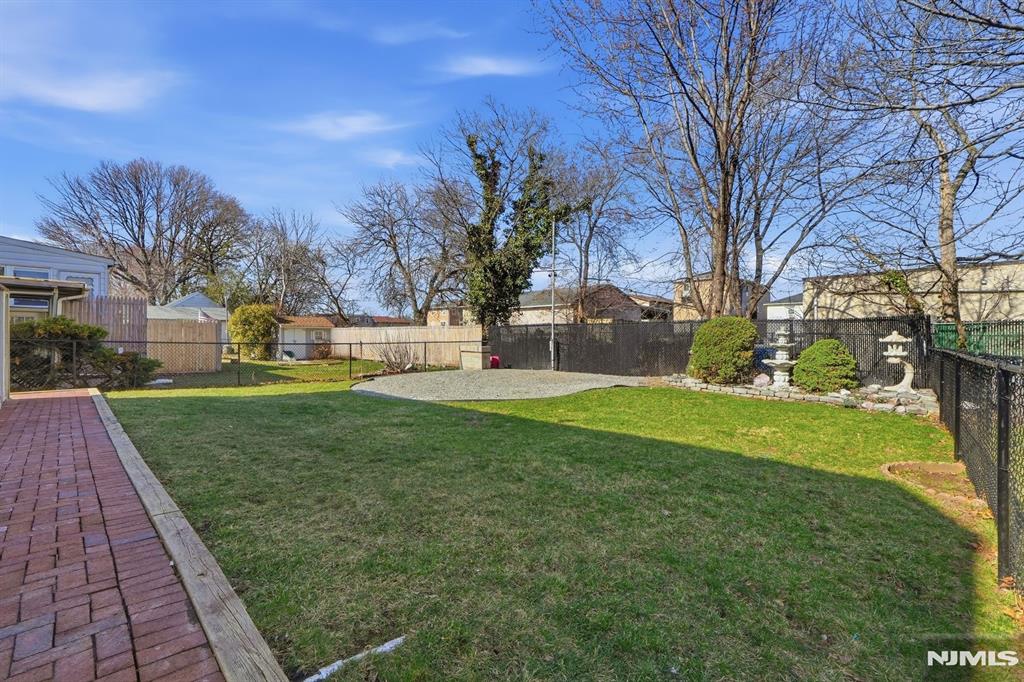 73 MacArthur Avenue Lodi, NJ 07644 - Photo 40 of 46 a view of a park with large trees