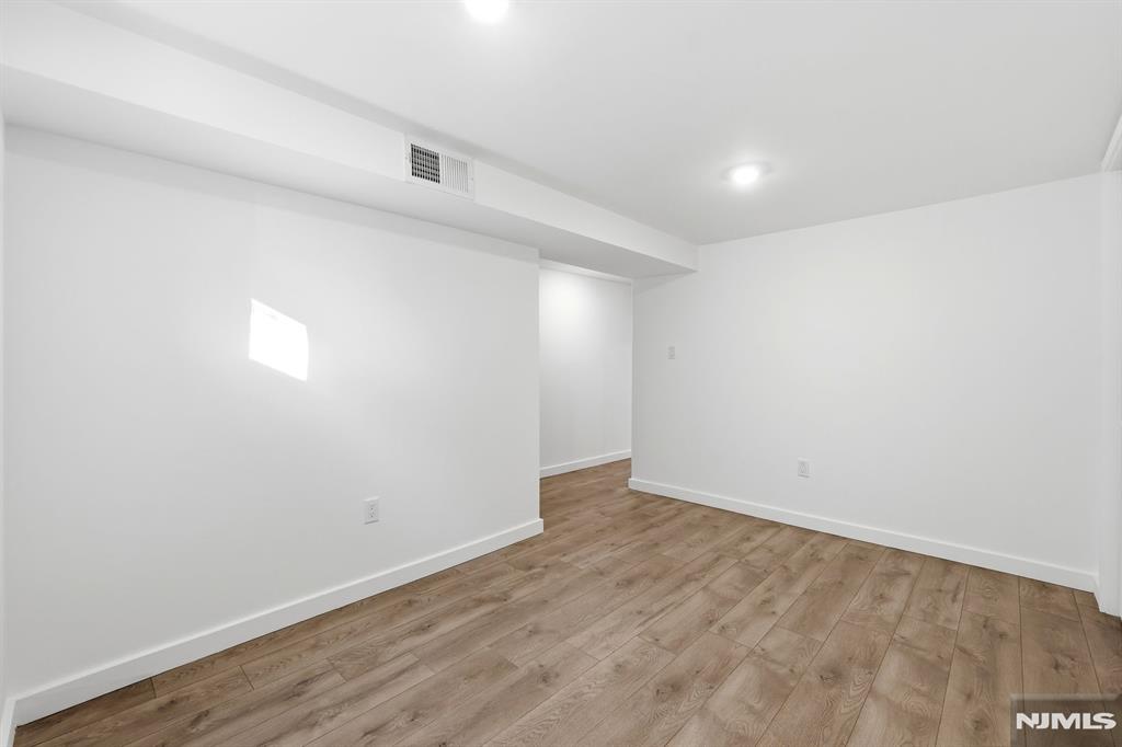 73 MacArthur Avenue Lodi, NJ 07644 - Photo 41 of 46 a view of an empty room