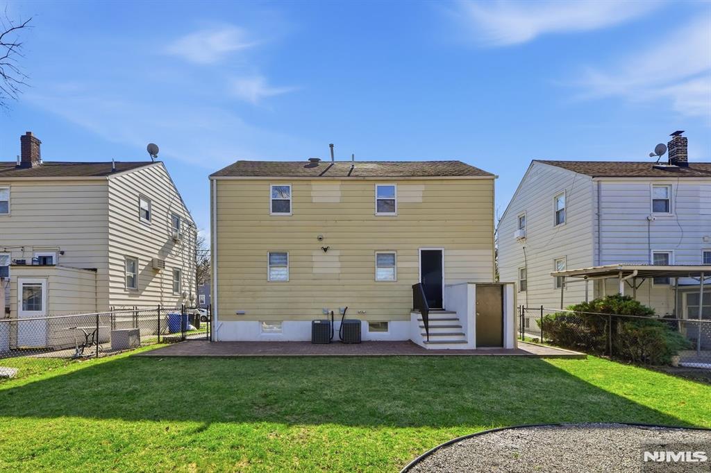 73 MacArthur Avenue Lodi, NJ 07644 - Photo 42 of 46 a front view of house with yard
