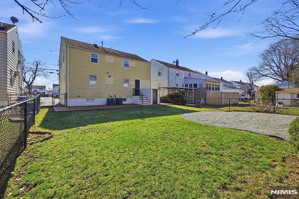 73 MacArthur Avenue Lodi, NJ 07644 - Photo 43 of 46 a view of a back yard of the house