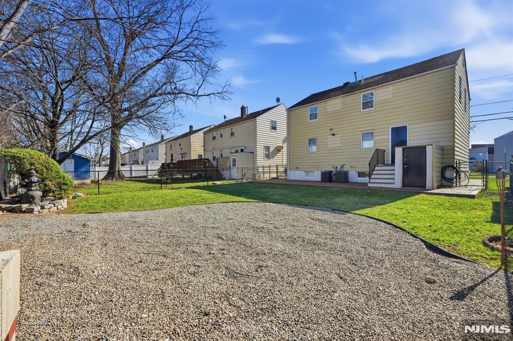 73 MacArthur Avenue Lodi, NJ 07644 - Photo 45 of 46 a view of a house with a yard