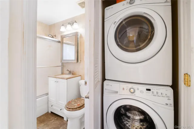 a view of a hallway with washer and dryer