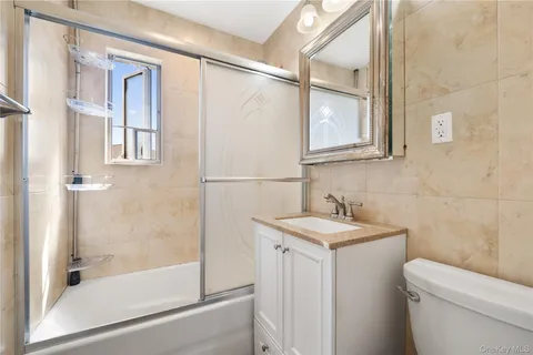 a bathroom with a toilet and a sink