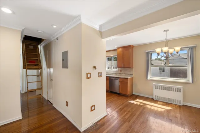 a view of a kitchen with a refrigerator stove top oven and cabinets
