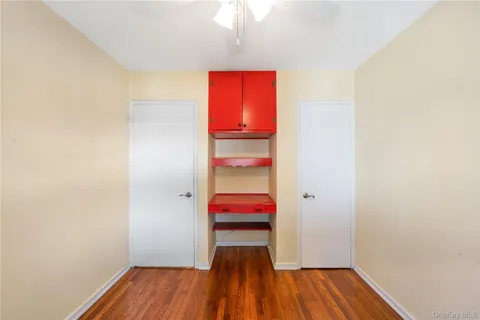 a view of a room with wooden floor