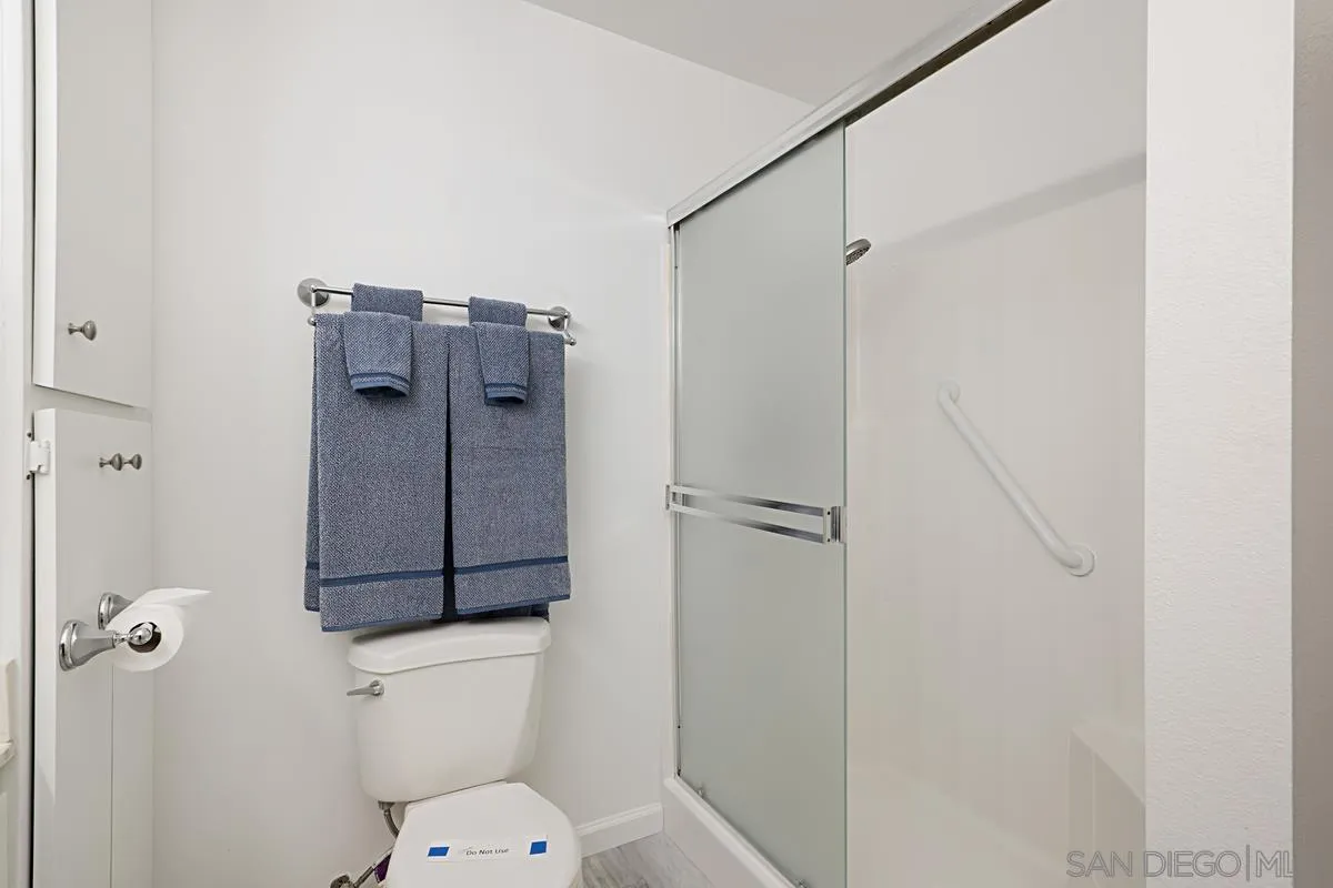 4523 Kittiwake Way Oceanside, CA 92057 - Photo 15 of 34 a bathroom with a toilet and a shower