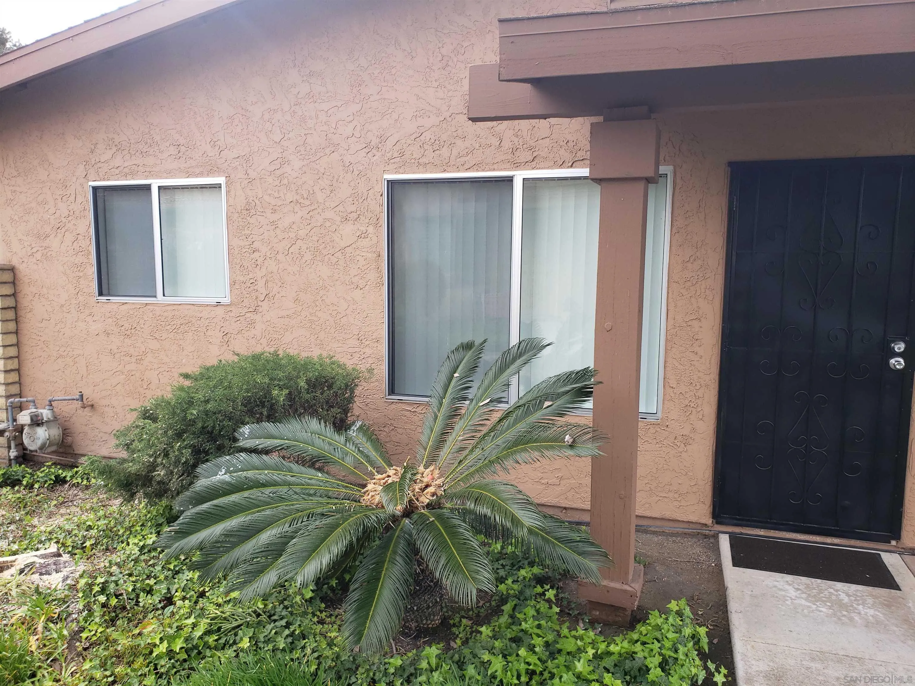4523 Kittiwake Way Oceanside, CA 92057 - Photo 22 of 34 a front view of a house with a yard