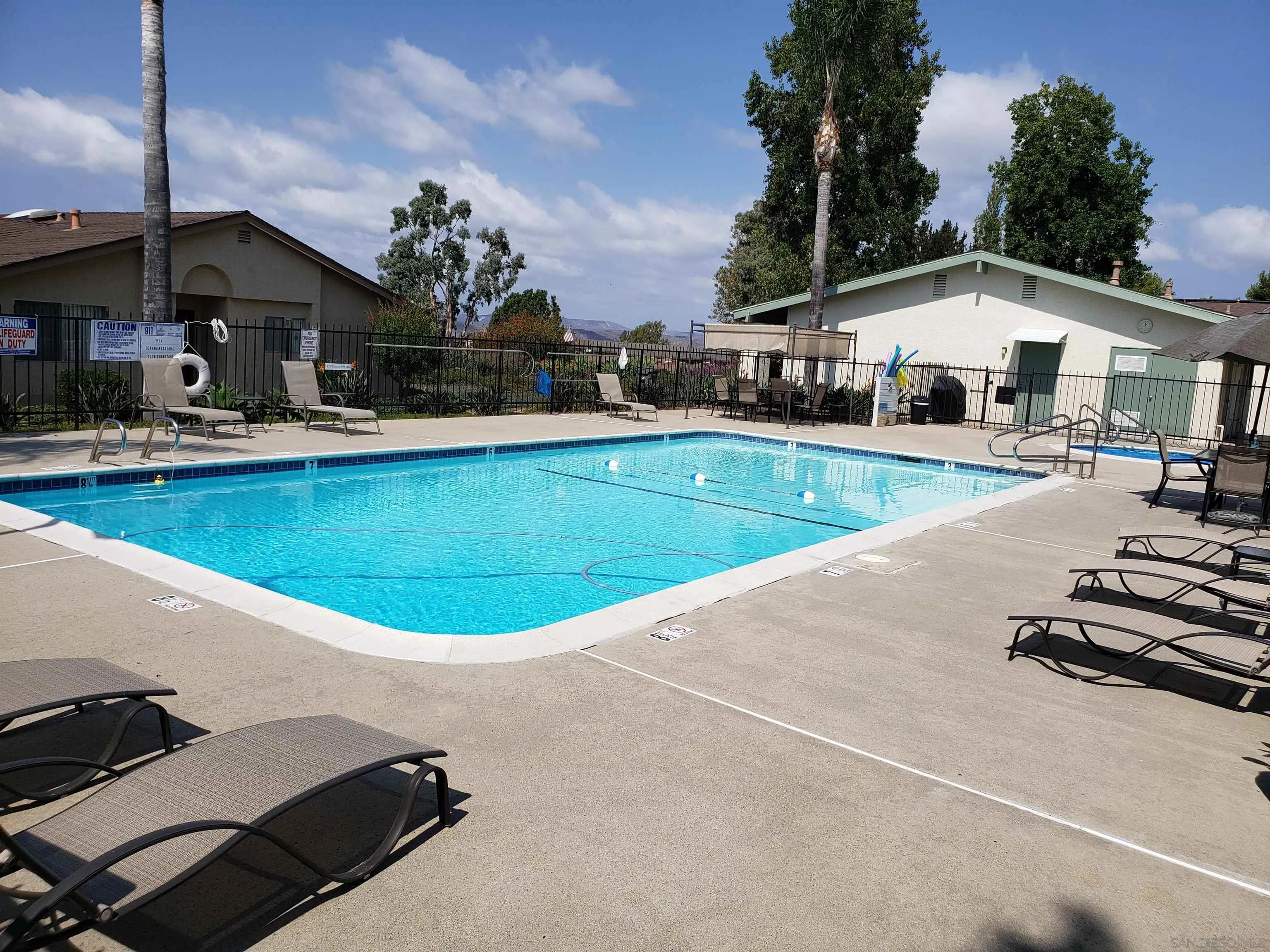 4523 Kittiwake Way Oceanside, CA 92057 - Photo 28 of 34 a view of a house with pool and chairs