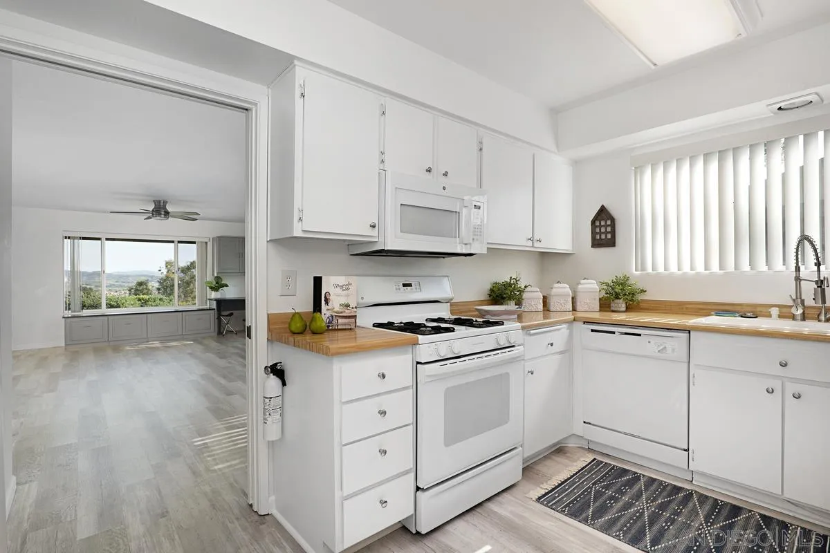 4523 Kittiwake Way Oceanside, CA 92057 - Photo 6 of 34 a kitchen with cabinets appliances and a window
