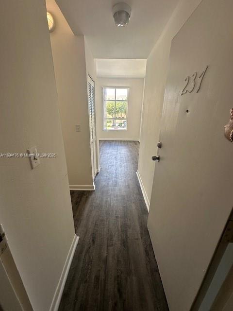 7420 West 20th Avenue, Unit 237 Hialeah, FL 33016 - Photo 12 of 34 wooden floor in a gallery next to a window