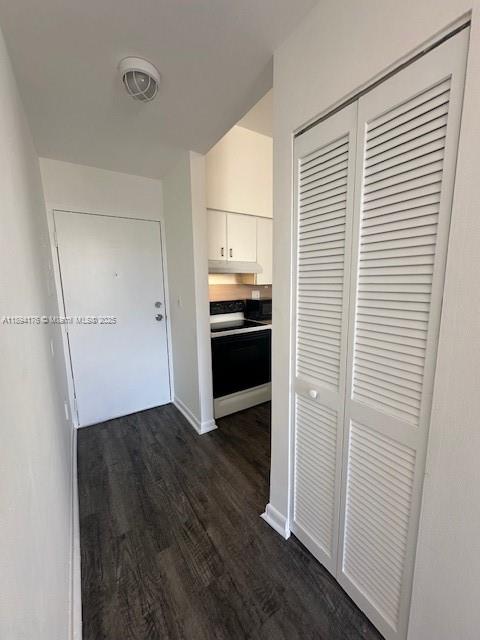 7420 West 20th Avenue, Unit 237 Hialeah, FL 33016 - Photo 20 of 34 an empty room with wooden floor cabinet and windows