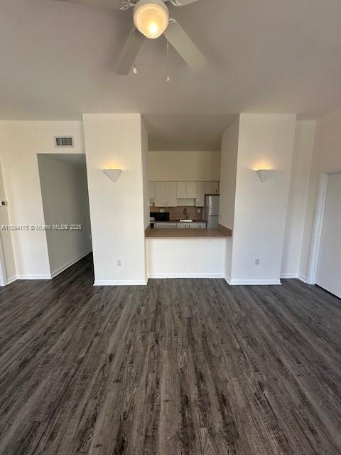 7420 West 20th Avenue, Unit 237 Hialeah, FL 33016 - Photo 25 of 34 a view of a kitchen with wooden floor and a sink