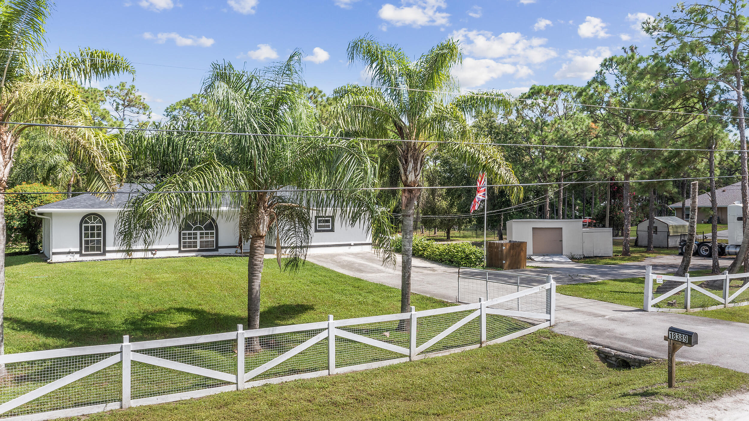 18389 41st Road North The Acreage, FL 33470 - Photo 11 of 44 a view of a swimming pool with a patio
