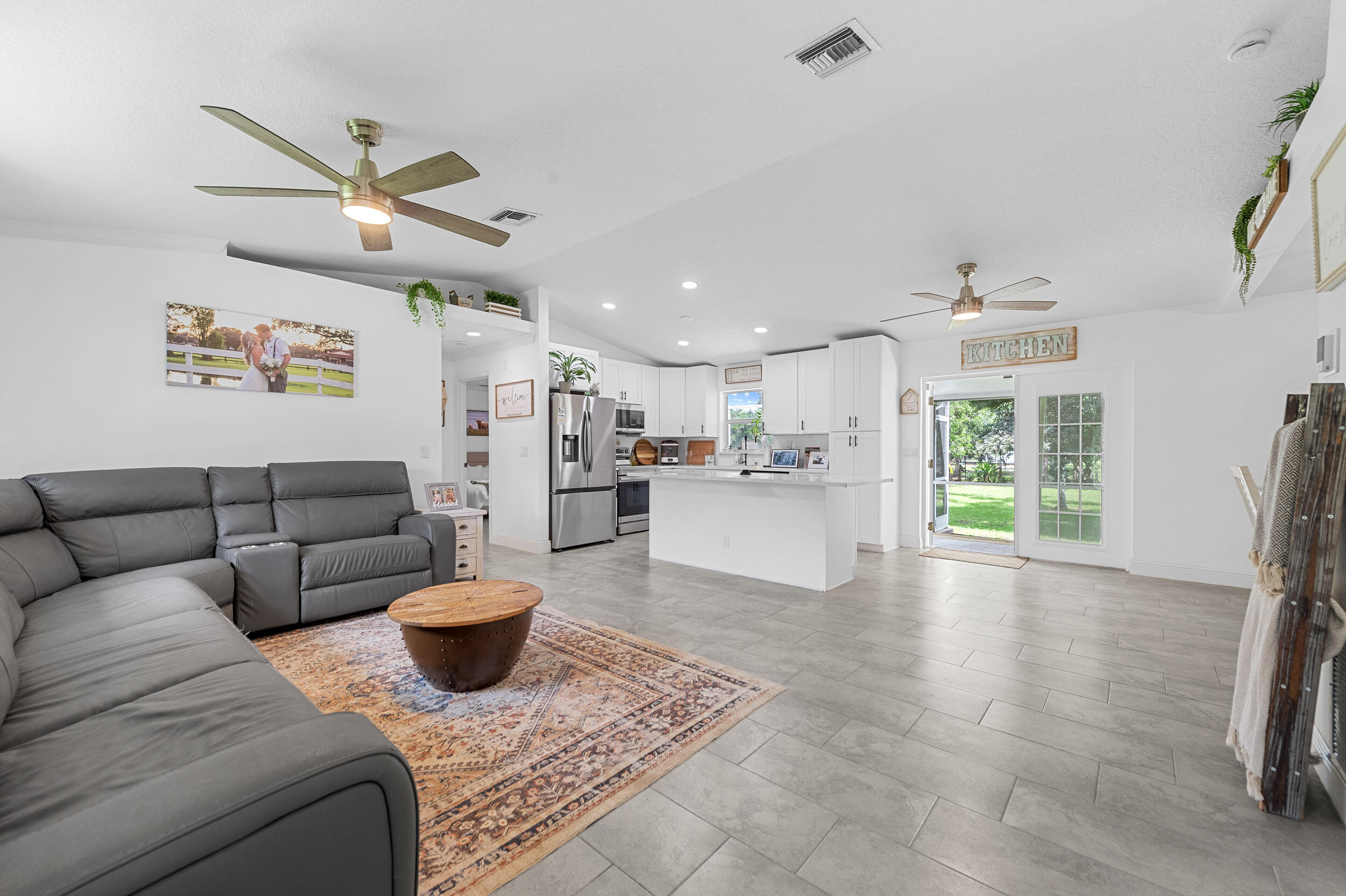 18389 41st Road North The Acreage, FL 33470 - Photo 15 of 44 a living room with furniture and a large window
