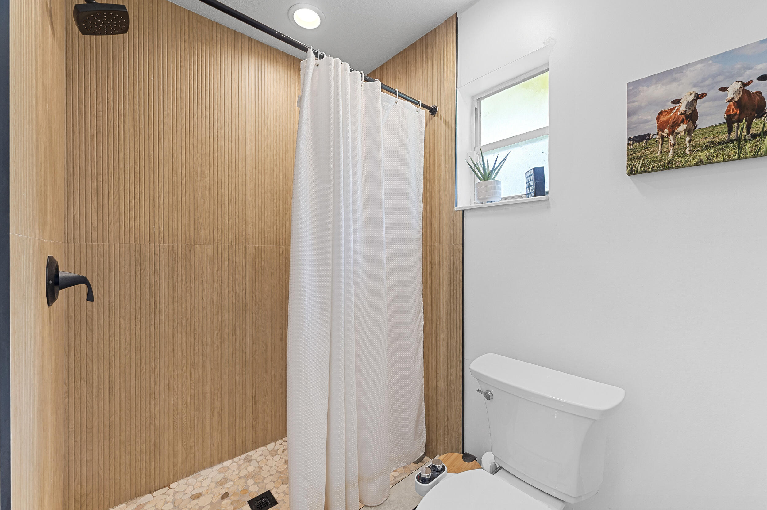 18389 41st Road North The Acreage, FL 33470 - Photo 31 of 44 a bathroom with a shower and a toilet