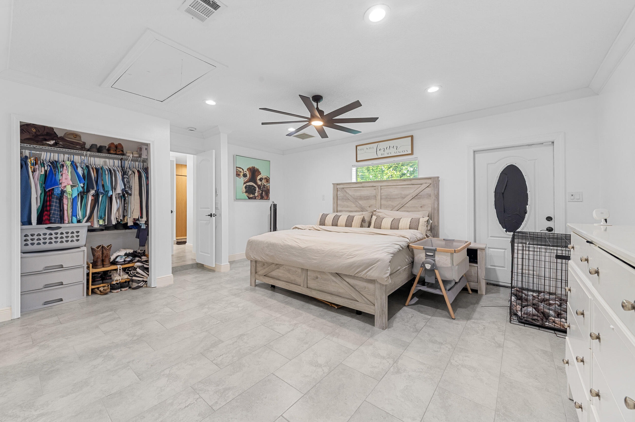 18389 41st Road North The Acreage, FL 33470 - Photo 36 of 44 a bedroom with a bed and furniture