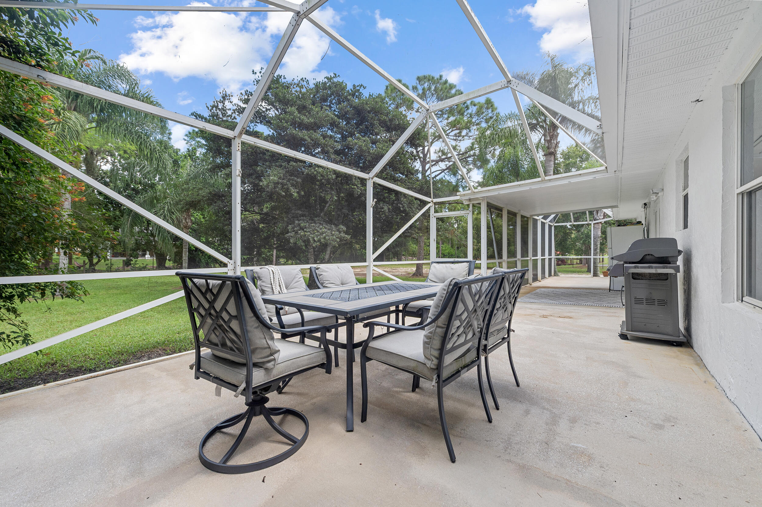 18389 41st Road North The Acreage, FL 33470 - Photo 38 of 44 a view of a roof deck with chair and table