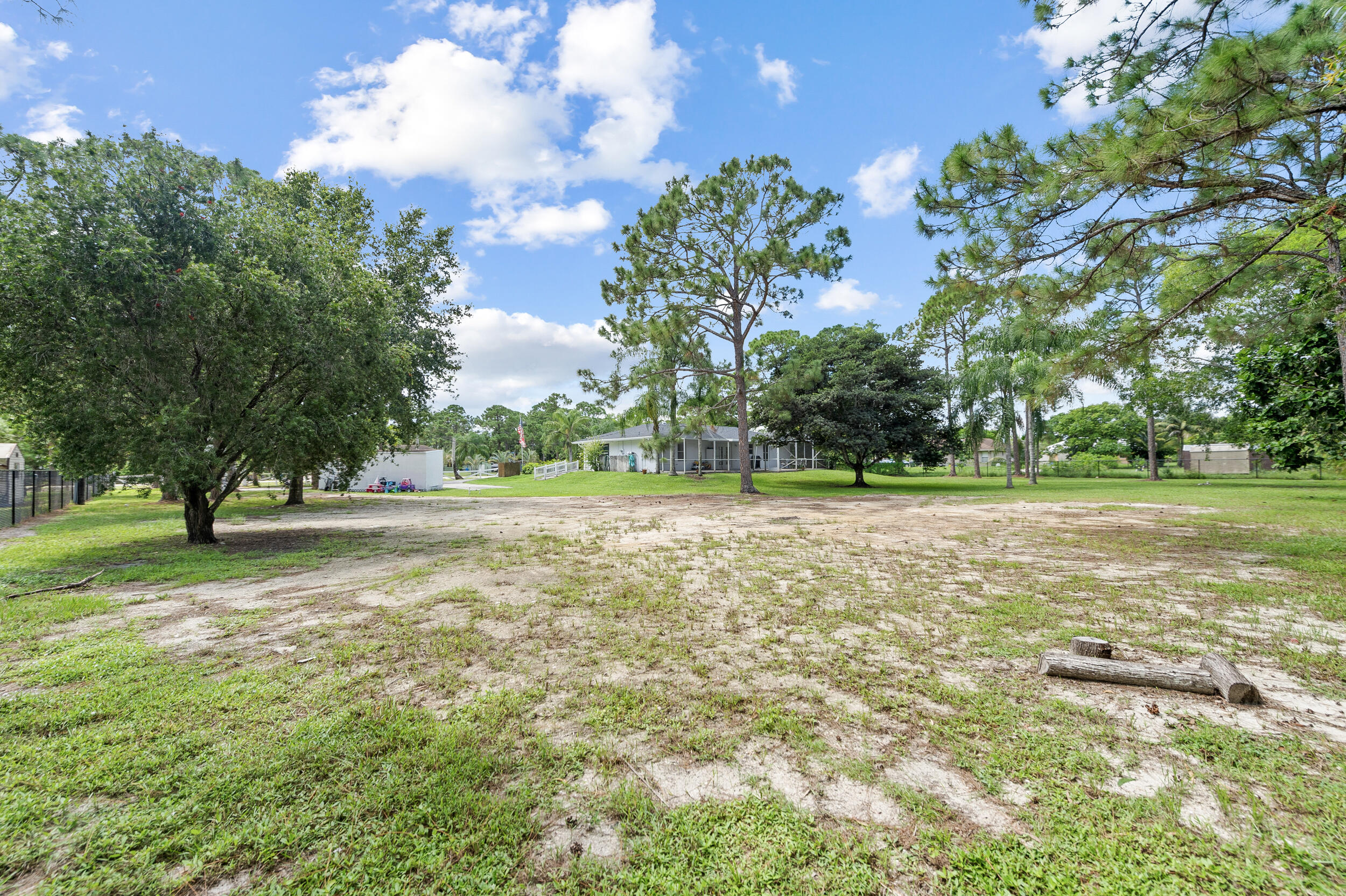 18389 41st Road North The Acreage, FL 33470 - Photo 43 of 44 a view of outdoor space with trees all around