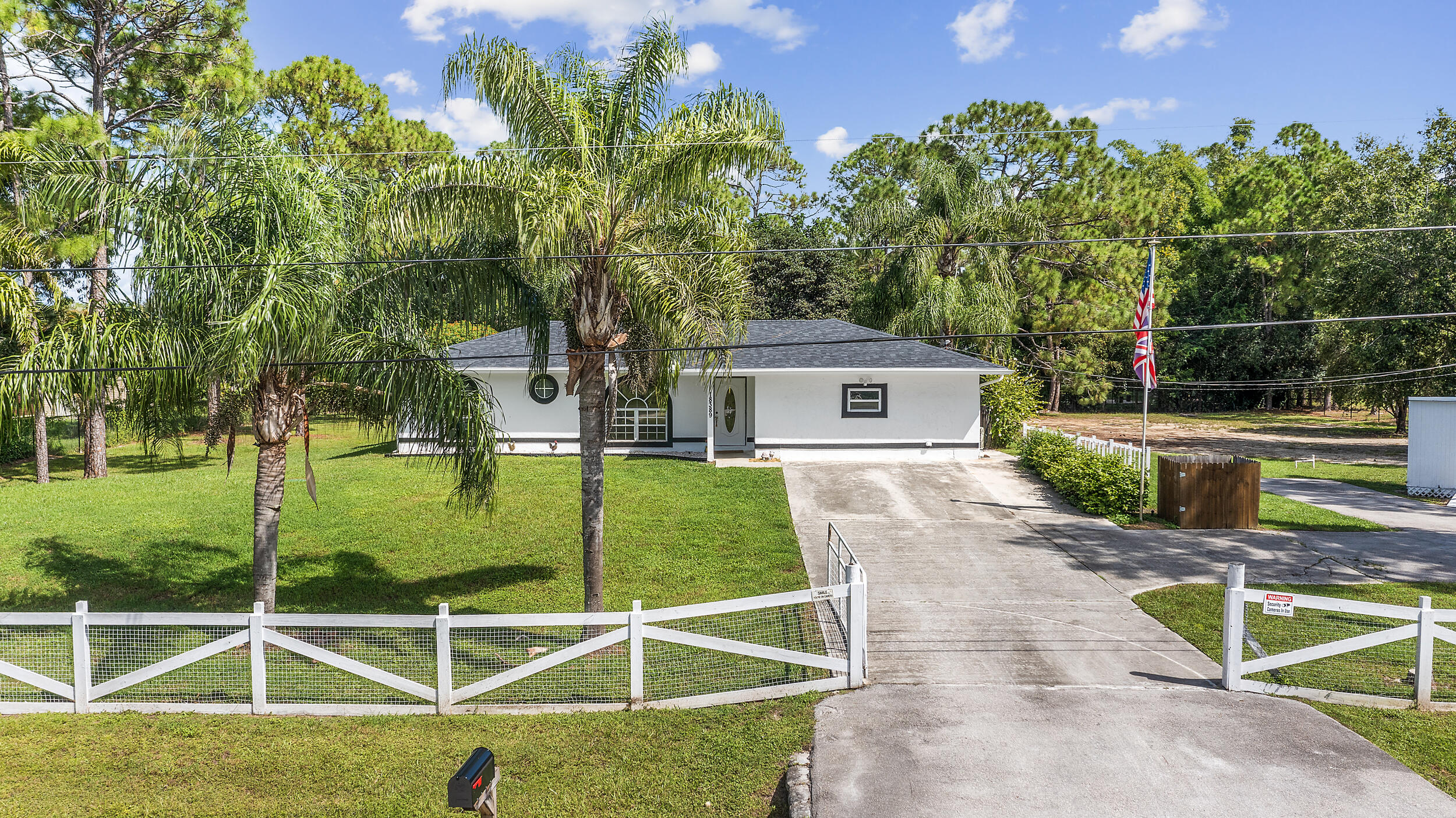 18389 41st Road North The Acreage, FL 33470 - Photo 9 of 44 a view of a house with backyard and sitting area