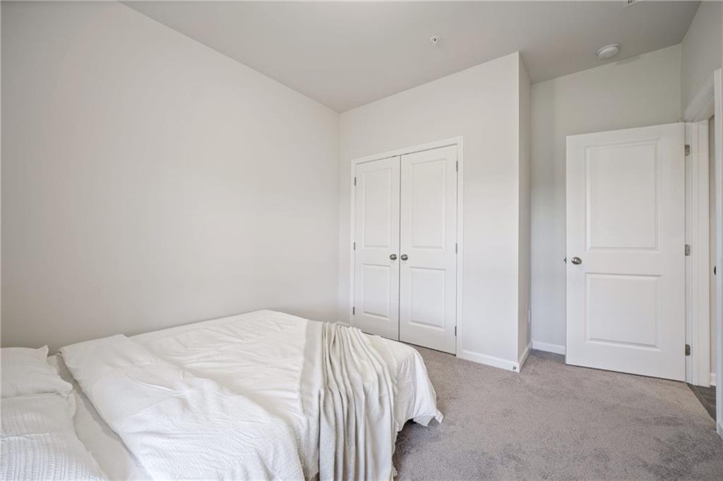 1595 Ridgebrook Downs Mableton, GA 30126 - Photo 27 of 39 a view of a bedroom with a bed and a closet