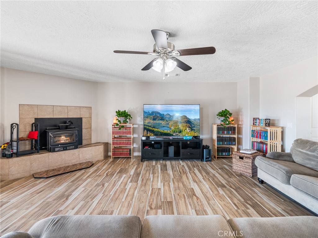 13850 Night Shade Road Apple Valley, CA 92307 - Photo 12 of 75 a living room with furniture and a fireplace