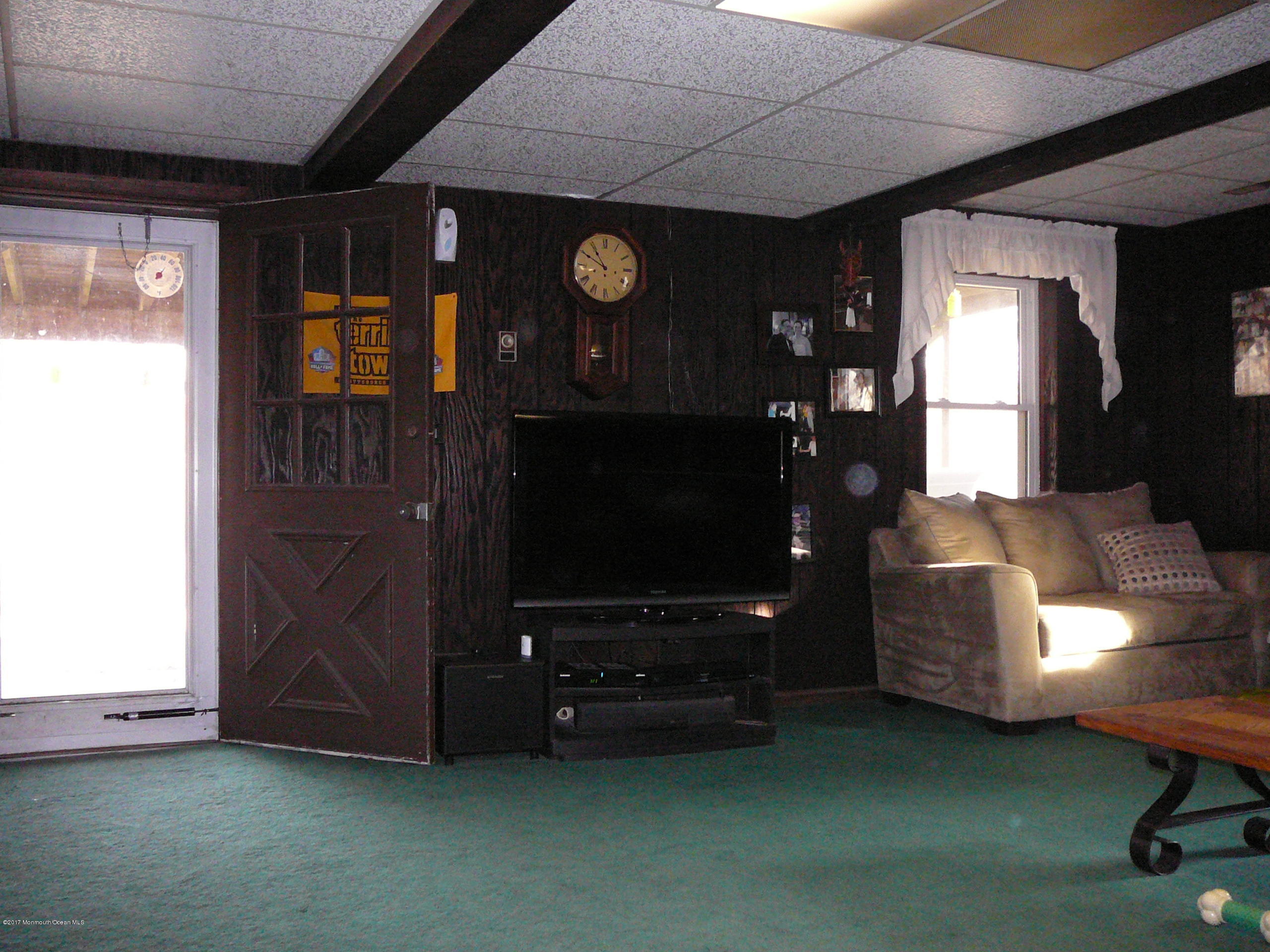 153 Colts Neck Road Farmingdale, NJ 07727 - Photo 14 of 18 family room leading to yard