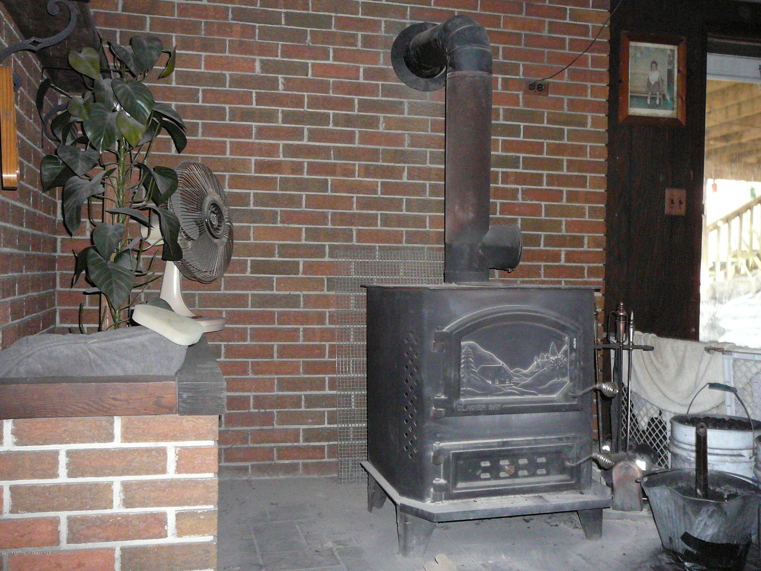 153 Colts Neck Road Farmingdale, NJ 07727 - Photo 15 of 18 wood-coal stove