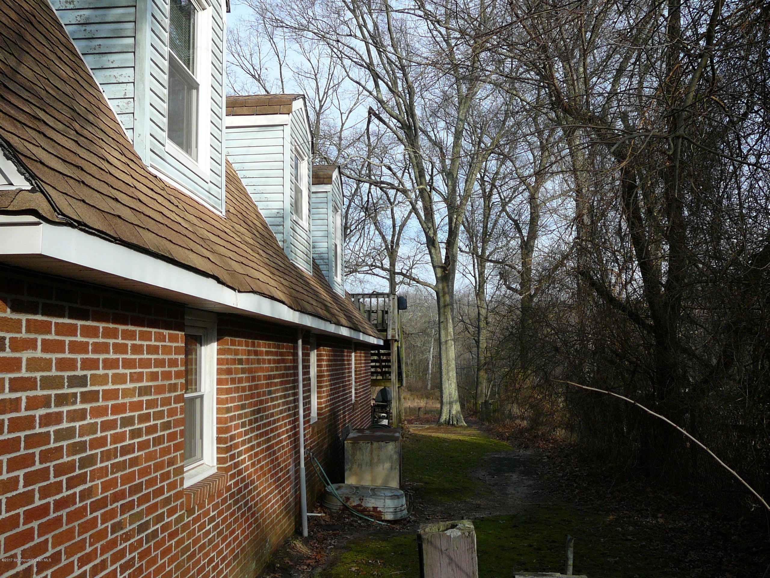 153 Colts Neck Road Farmingdale, NJ 07727 - Photo 6 of 18 back of house dormers