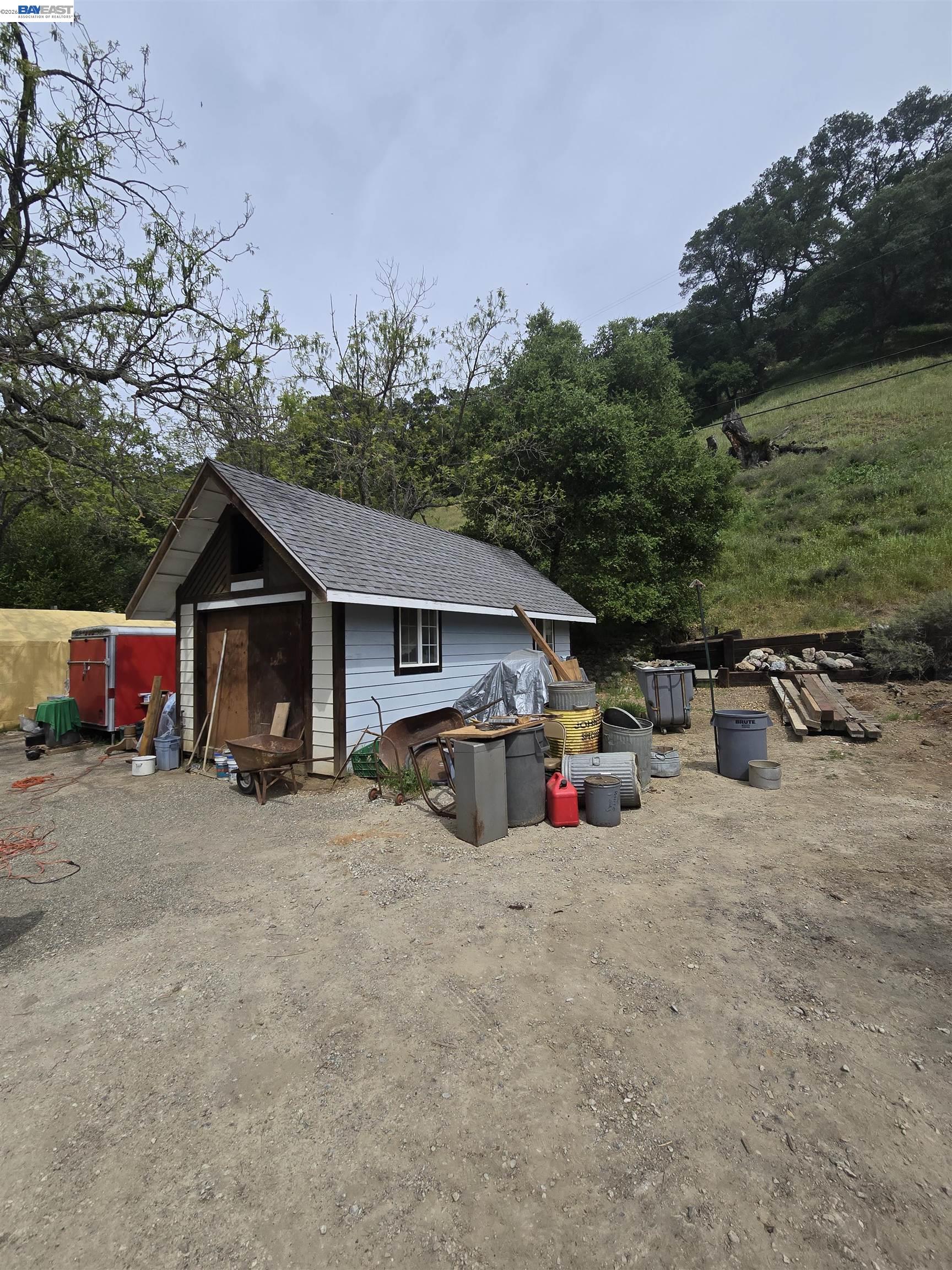 821 Kilkare Road Sunol, CA 94586 - Photo 14 of 16 a view of the house with wooden fence