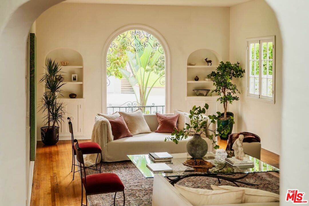 3325 Lowry Road Los Angeles, CA 90027 - Photo 19 of 73 a living room with furniture and a large mirror next to a window