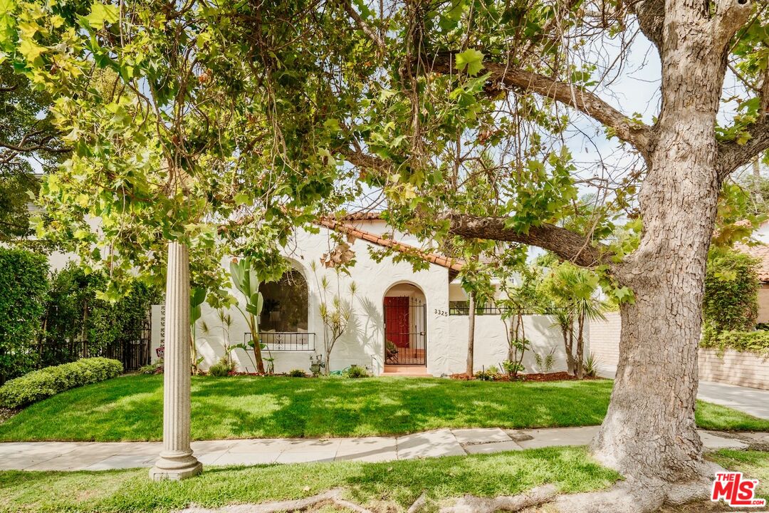 3325 Lowry Road Los Angeles, CA 90027 - Photo 2 of 73 a view of white house with a yard and large trees