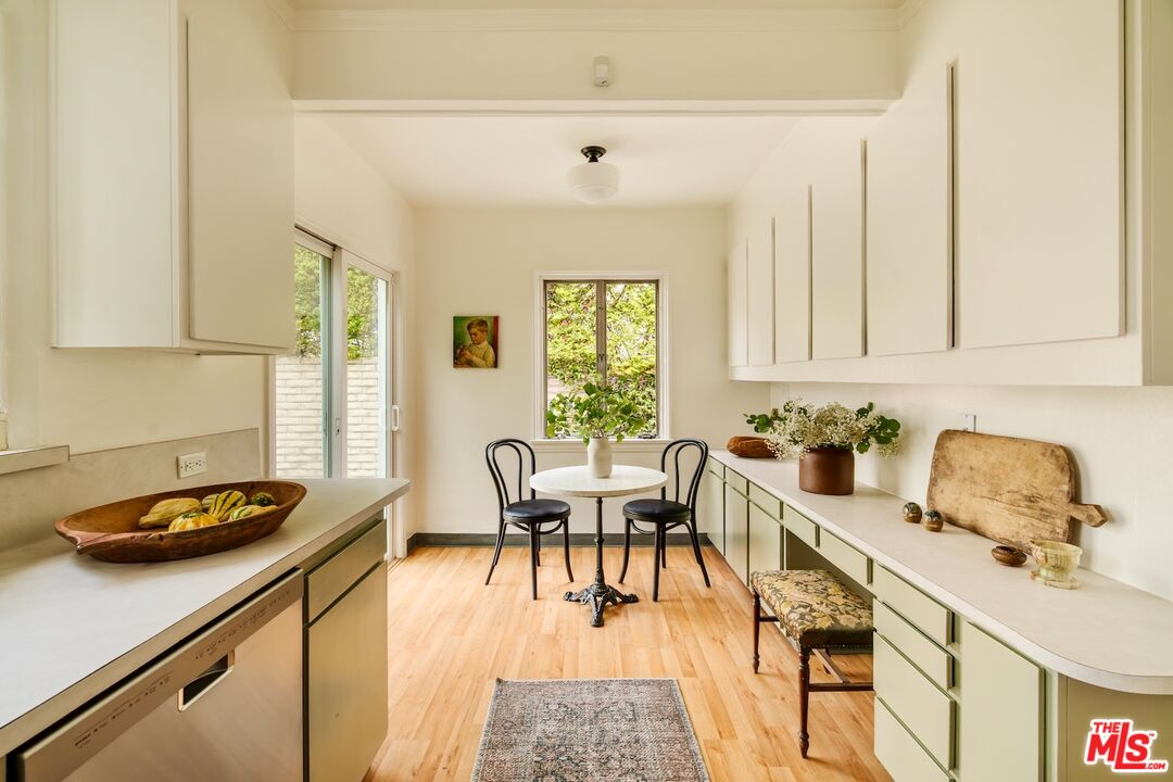 3325 Lowry Road Los Angeles, CA 90027 - Photo 27 of 73 a dining room with furniture and a window