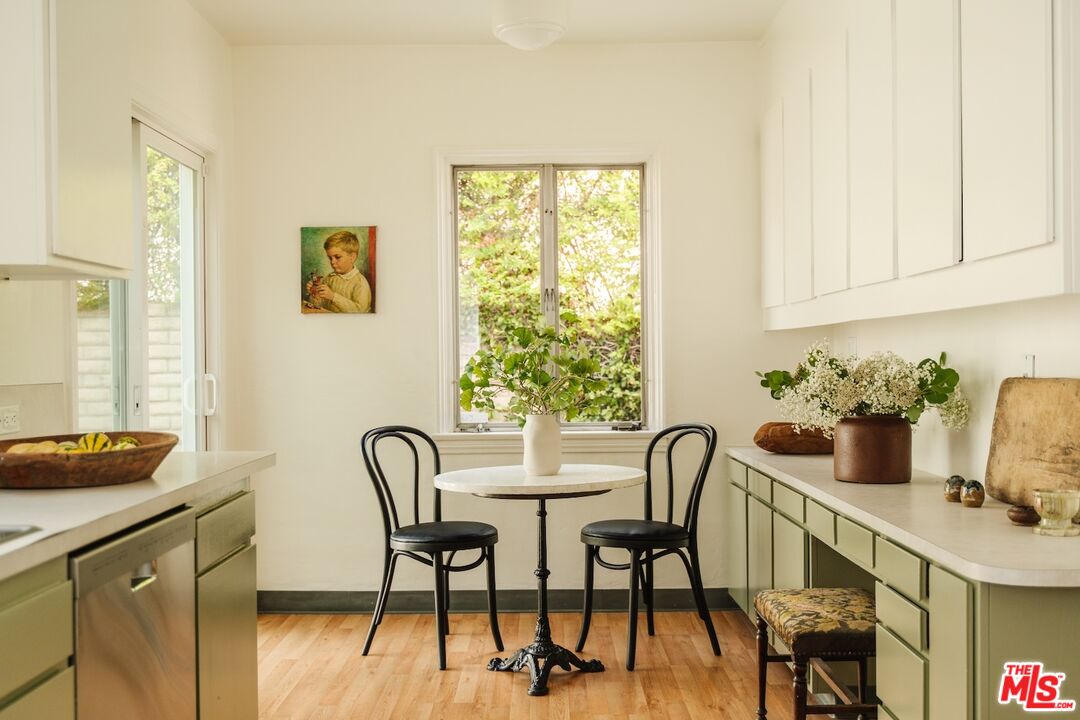3325 Lowry Road Los Angeles, CA 90027 - Photo 28 of 73 a view of a dining room with furniture and a window