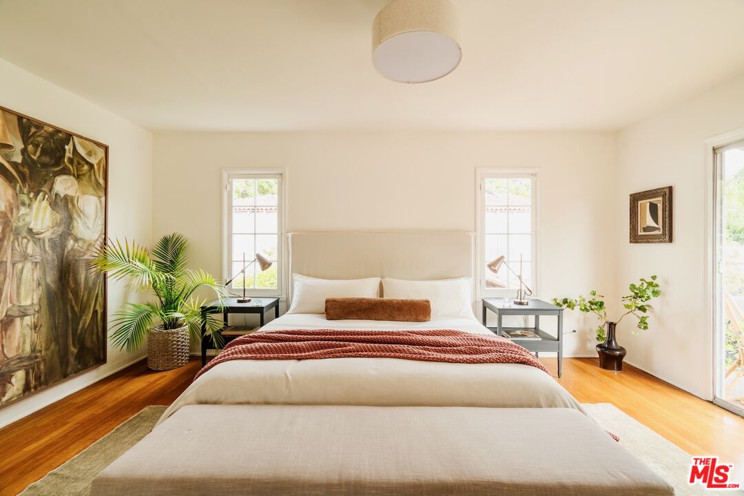 3325 Lowry Road Los Angeles, CA 90027 - Photo 33 of 73 a bedroom with a large bed and a potted plant